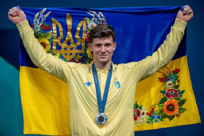 The coach of the Ukrainian national team talks to the gymnast
